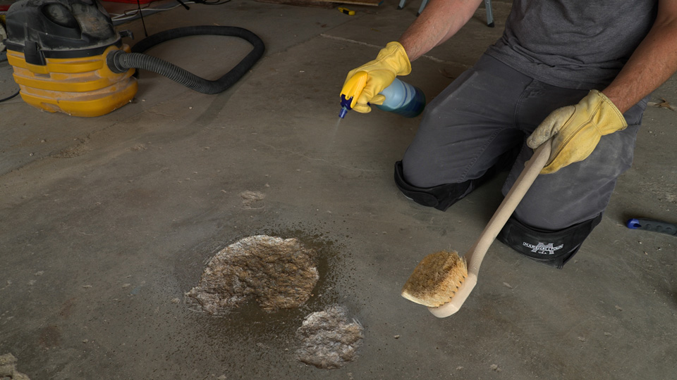 spraying detergent on repair area